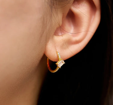 Close-up of a woman's ear showcasing MoissaniteHoopEarringswithMorganite