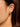 Close-up of a woman's neck showcasing MoissaniteOverlappedSilverTriangleEarrings