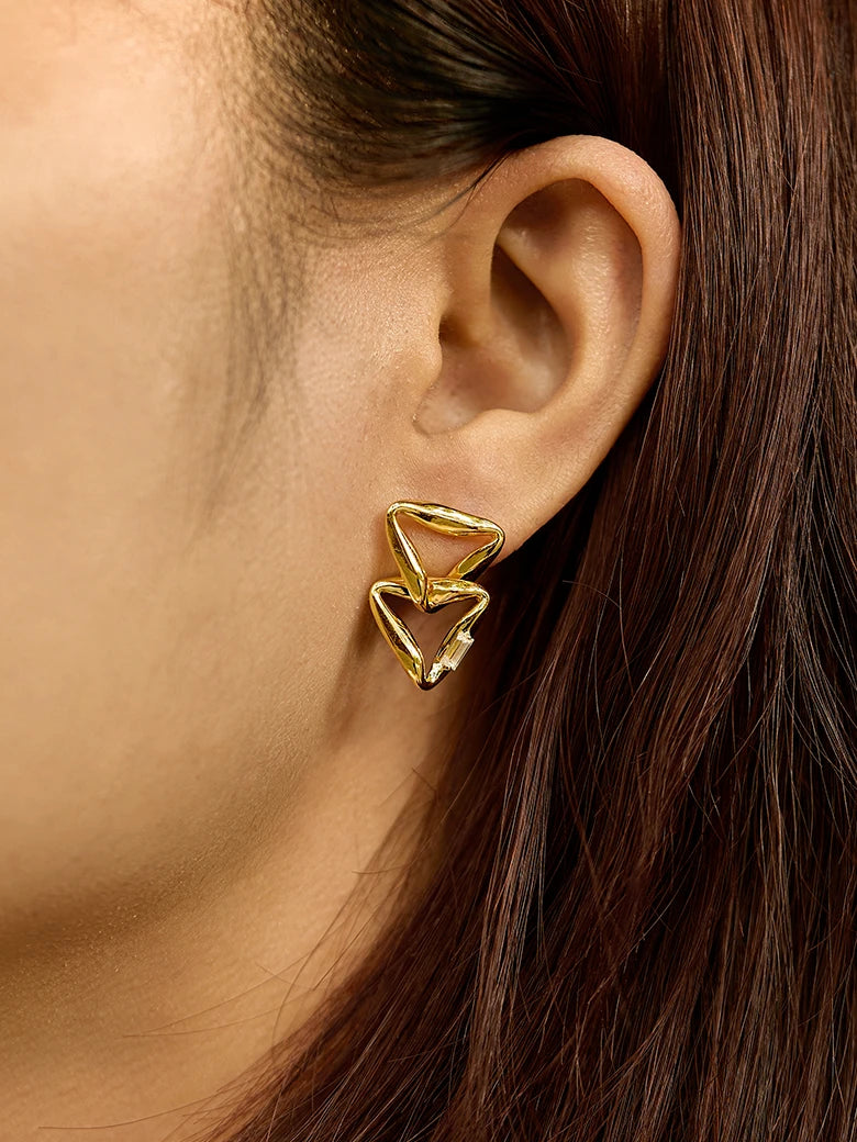 Close-up of a woman's neck showcasing MoissaniteOverlappedTriangleEarrings