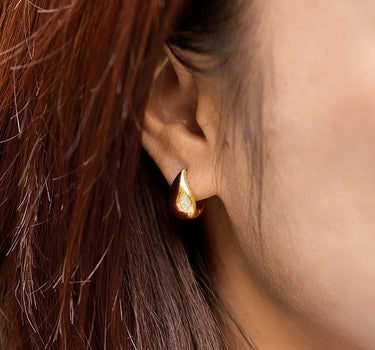 Close-up of a woman's neck showcasingMoissanite Teardrop Hoop Earrings