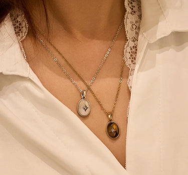 Close-up of a woman's neck showcasing Moonstone Signature Silver Charm
