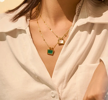 Close-up of a woman's neck showcasing Mother of Pearl Charm Necklace