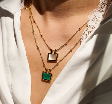 Close-up of a woman's neck showcasing Mother of Pearl Charm Necklace