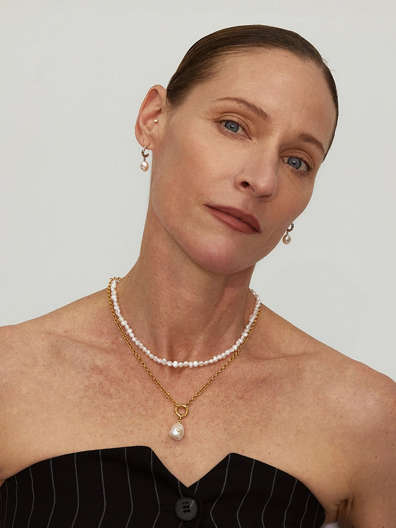 Close-up of a woman's neck showcasing O-Link Core Necklace