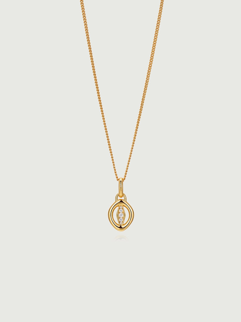 Oculus Diamond Charm Necklace featuring a circular charm in polished gold with a diamond detail.