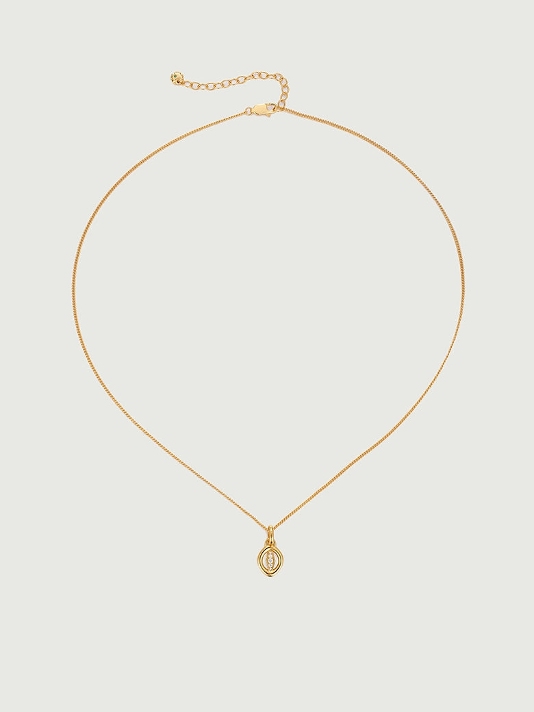 Oculus Diamond Charm Necklace featuring a minimalist circular charm in polished gold metal.