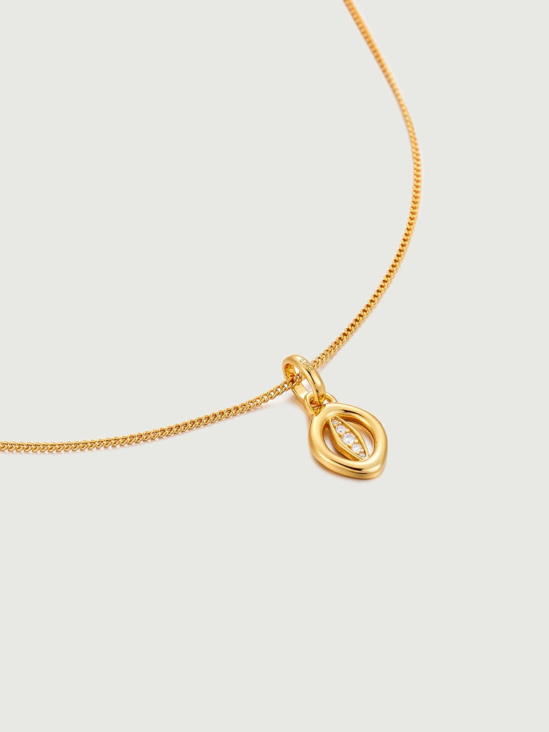 Oculus Diamond Charm Necklace featuring a minimalist gold design with a diamond charm.