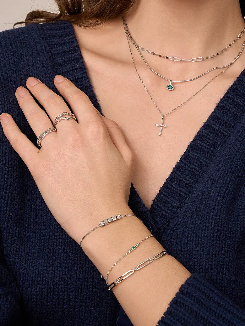 Close-up of a woman's wrist showcasing
Paperclip Silver Banlge