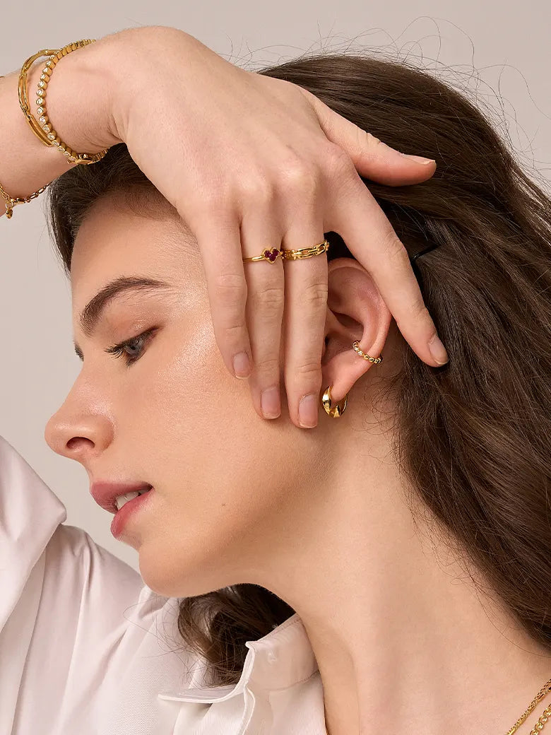 Close-up of a woman's finger showcasing PaperclipStackingRing