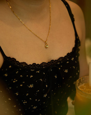 A close-up of the Pear Dome Pendant Necklace worn on a person, showcasing its elegant moissanite stone and modern design.