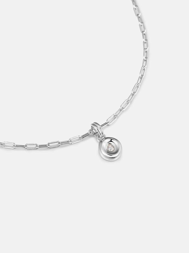 Pear Dome Silver Pendant Necklace featuring a domed silver pendant with a moissanite stone on a paperclip chain.