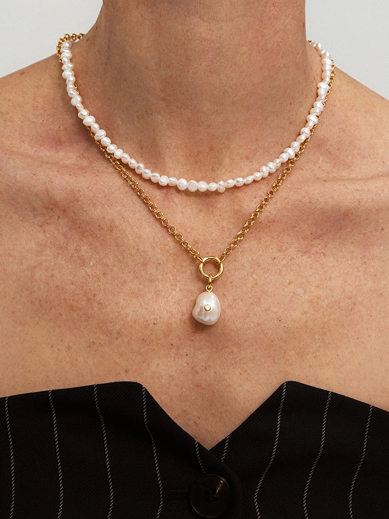 Close-up of a woman's neck showcasing Pearl Glow Diamond Pendant