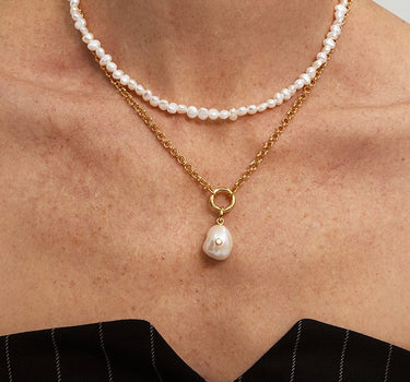 Close-up of a woman's neck showcasing Pearl Glow Diamond Pendant