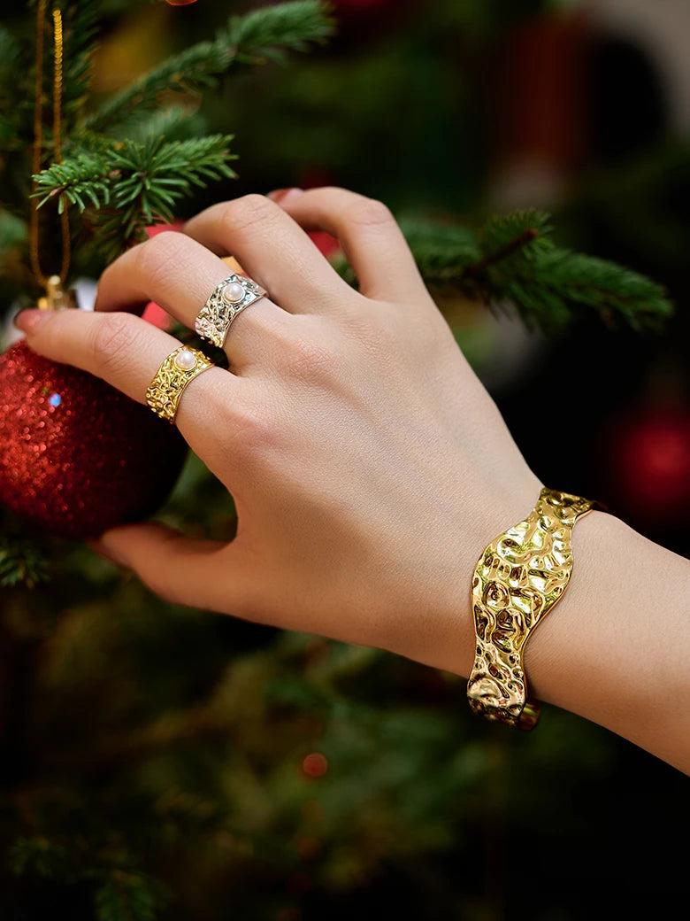 Close-up of a woman's finger showcasing Pearl Wide Band Ring