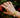 Close-up of a woman's finger showcasing Pearl Wide Band Ring