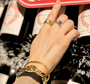Close-up of a woman's finger showcasing Pearl Wide Band Silver Ring