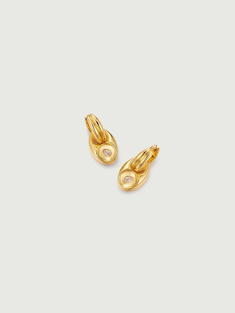 Pebble Solitaire Drops Earrings featuring an organic gold design with solitaire moissanite stones.