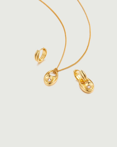 Pebble Solitaire Drops Earrings featuring gold tone necklace and earrings with moissanite accents.