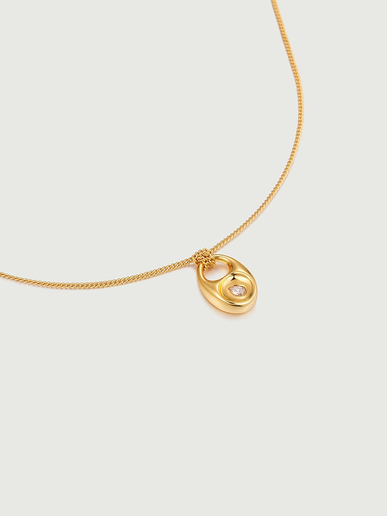 Close-up of Pebble Teardrop Charm Necklace featuring a gold chain and a moissanite charm.