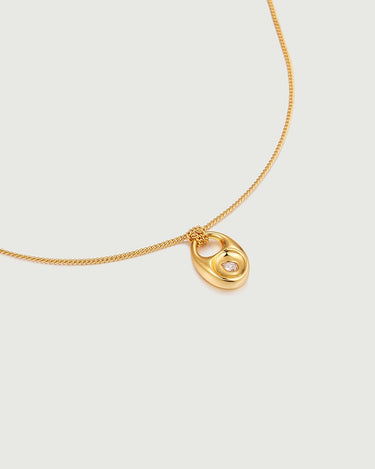 Close-up of Pebble Teardrop Charm Necklace featuring a gold chain and a moissanite charm.