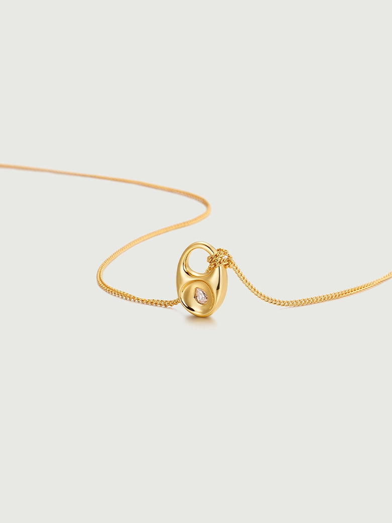 Pebble Teardrop Charm Necklace featuring a gold chain and detachable teardrop charm with moissanite center stone.