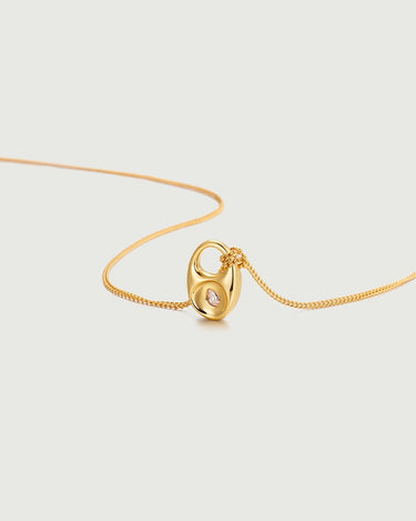 Pebble Teardrop Charm Necklace featuring a gold chain and detachable teardrop charm with moissanite center stone.