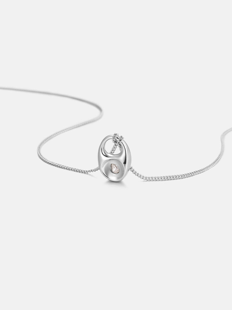 Pebble Teardrop Silver Charm Necklace featuring a smooth teardrop pendant on a delicate chain.