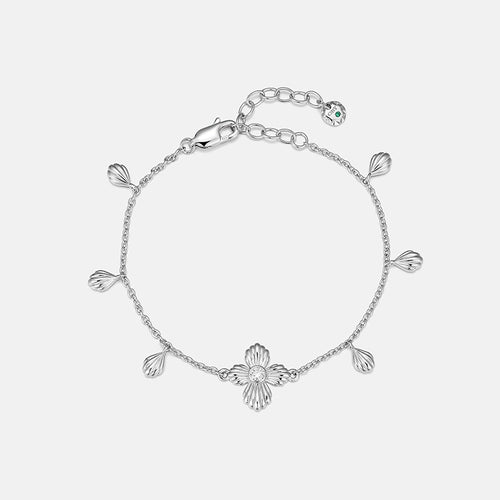 Petal Dewdrop Chain Bracelet featuring delicate petal drops and fluted clover, designed for fluid movement.