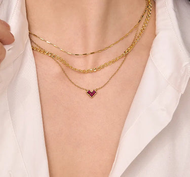 Close-up of a woman's neck showcasing PrincessCutRubyHeartNecklace