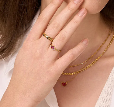 Close-up of a woman's finger showcasing
Princess Cut Ruby Heart Ring