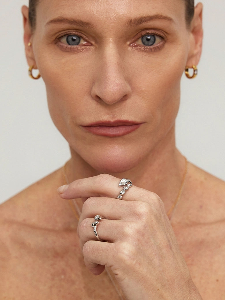 Close-up of a woman's ring showcasing Raindrop Cluster Silver Ring