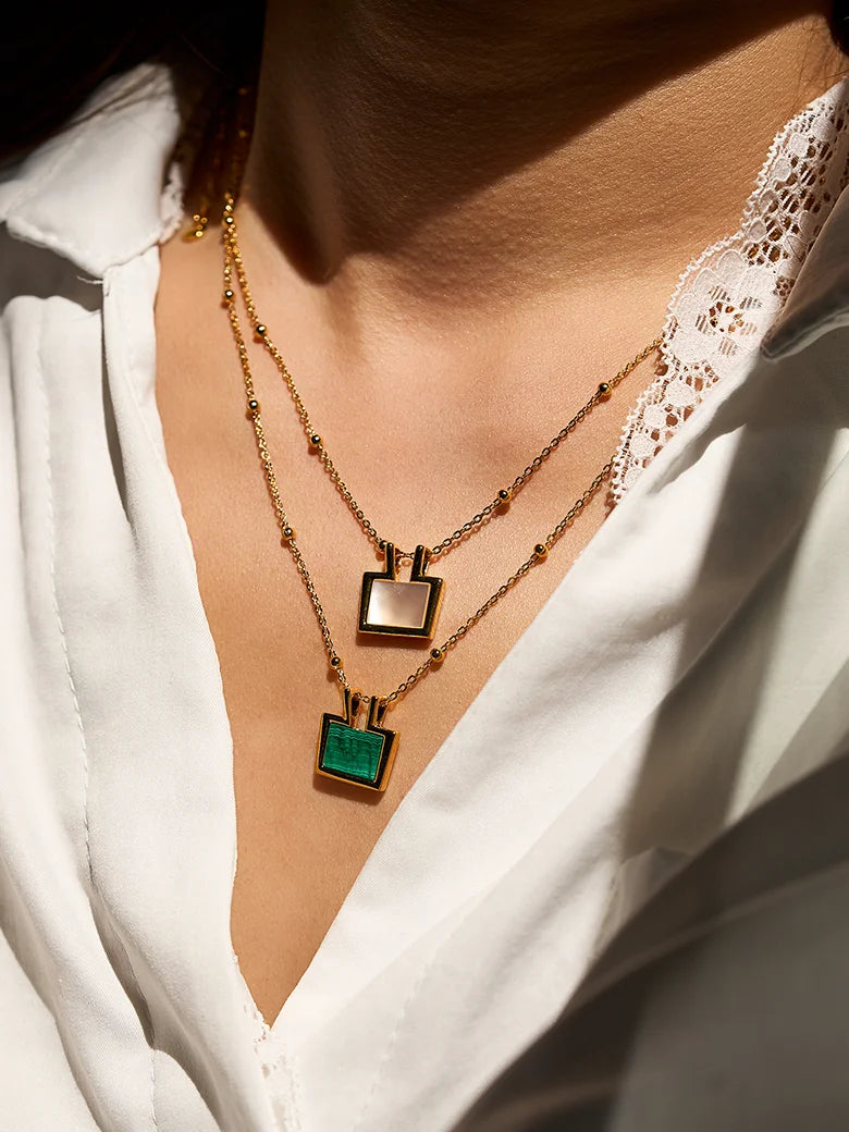 Close-up of a woman's neck showcasing Rectangle Malachite Charm Necklace