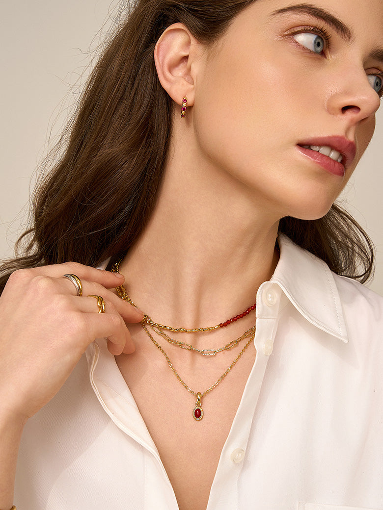 Close-up of a woman's neck showcasing
Red Coral Charm