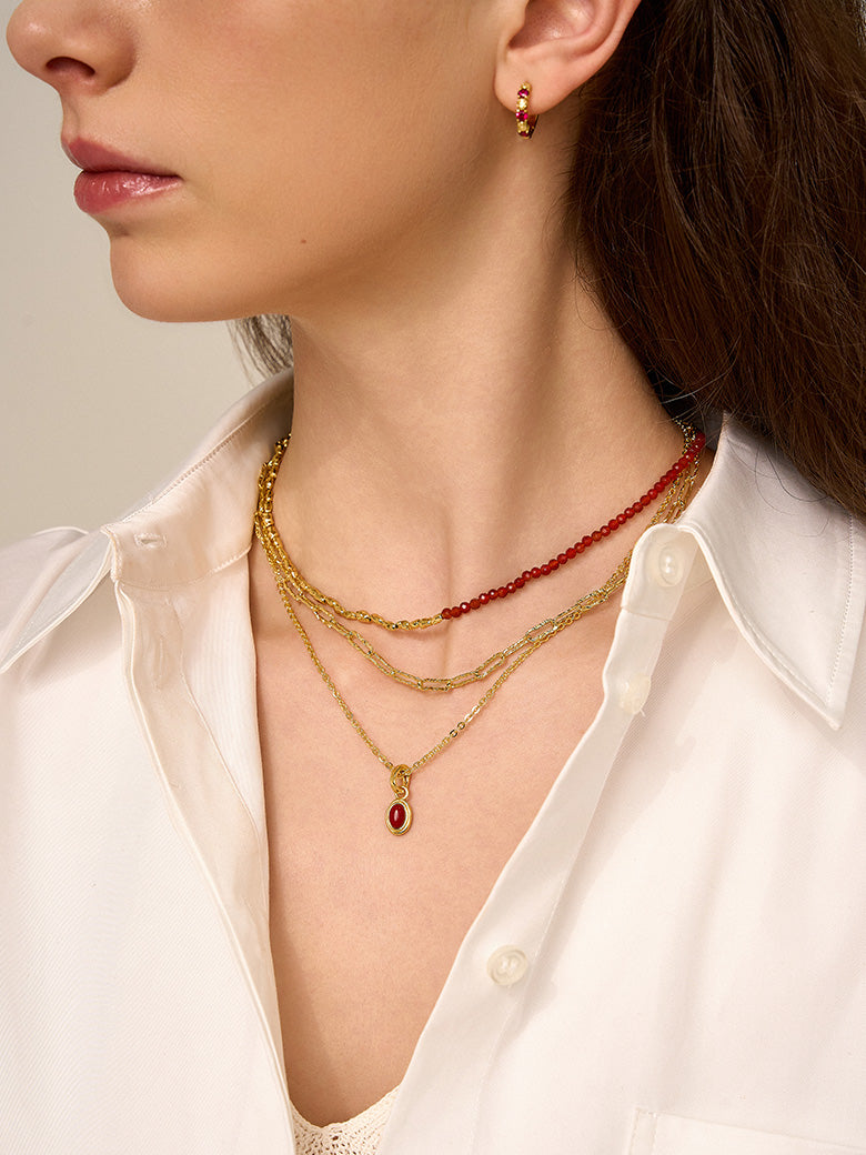 Close-up of a woman's neck showcasing
Red Coral Charm