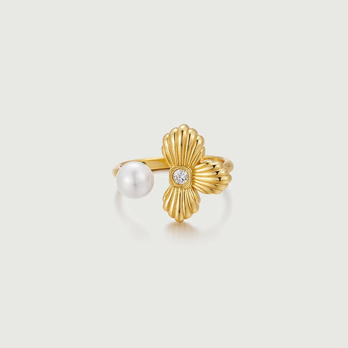 Shell Petal Ring featuring a textured golden shell-petal and luminous pearl for a playful look.