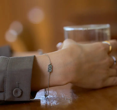 Close-up of a woman's wrist showcasing Silver Stellar Birthstone Engravable Bracelet
