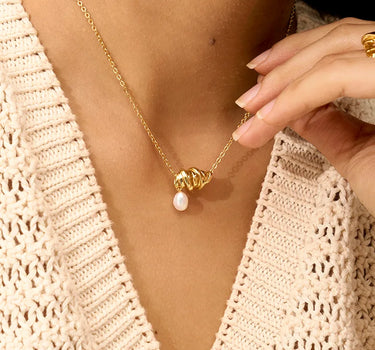 Close-up of a woman's neck showcasing Elegance Pearl Set