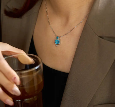 Close-up of a woman's neck showcasing Slideable Versailles Topaz Necklace