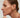 Close-up of a woman's ear showcasing Tiger_sEyeDuoHoopEarrings 