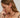 Close-up of a woman's ear showcasing Tiger_sEyeDuoHoopSilverEarrings
