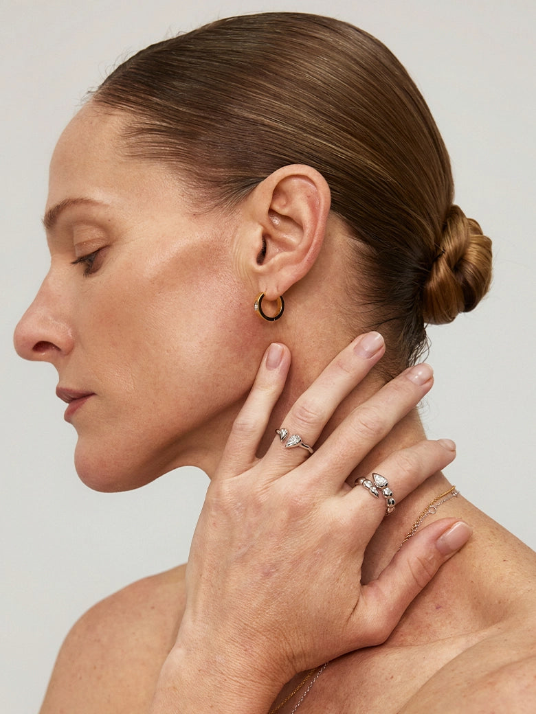 Close-up of a woman's ringshowcasing Twin Drop Ring