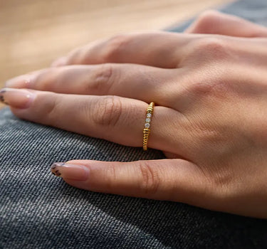 Close-up of a woman's finger showcasing Twist Diamond Ring