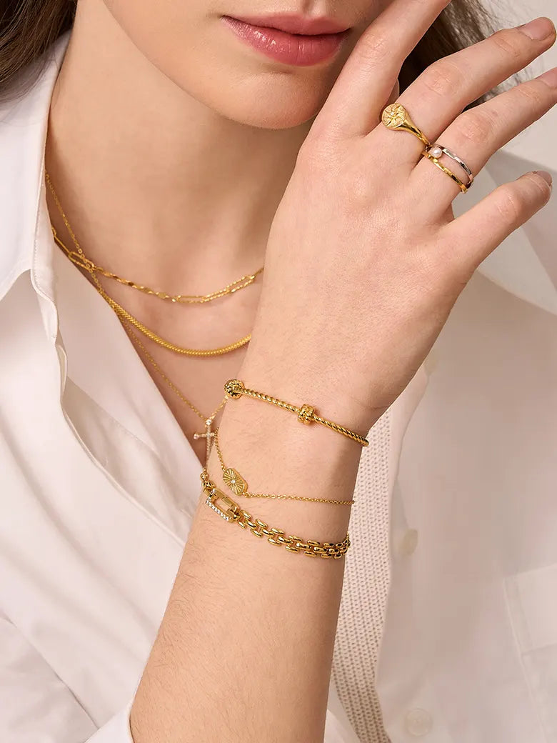 Close-up of a woman's wrist showcasing
Twist Kink Bangle