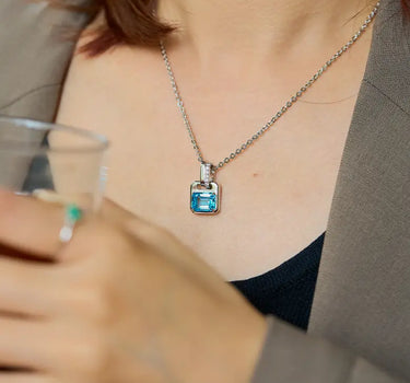 Close-up of a woman's neck showcasing Versailles Topaz Pendant Charm