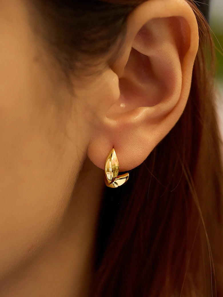 Close-up of a woman's neck showcasing WheatStudEarrings