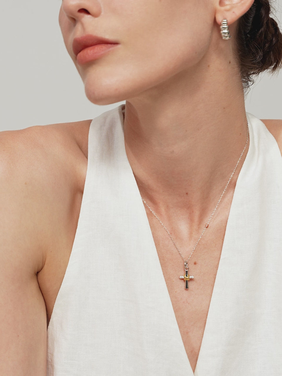 Interlock Diamond Cross Pendant featuring sterling silver and 18K gold vermeil elements with pave-set 